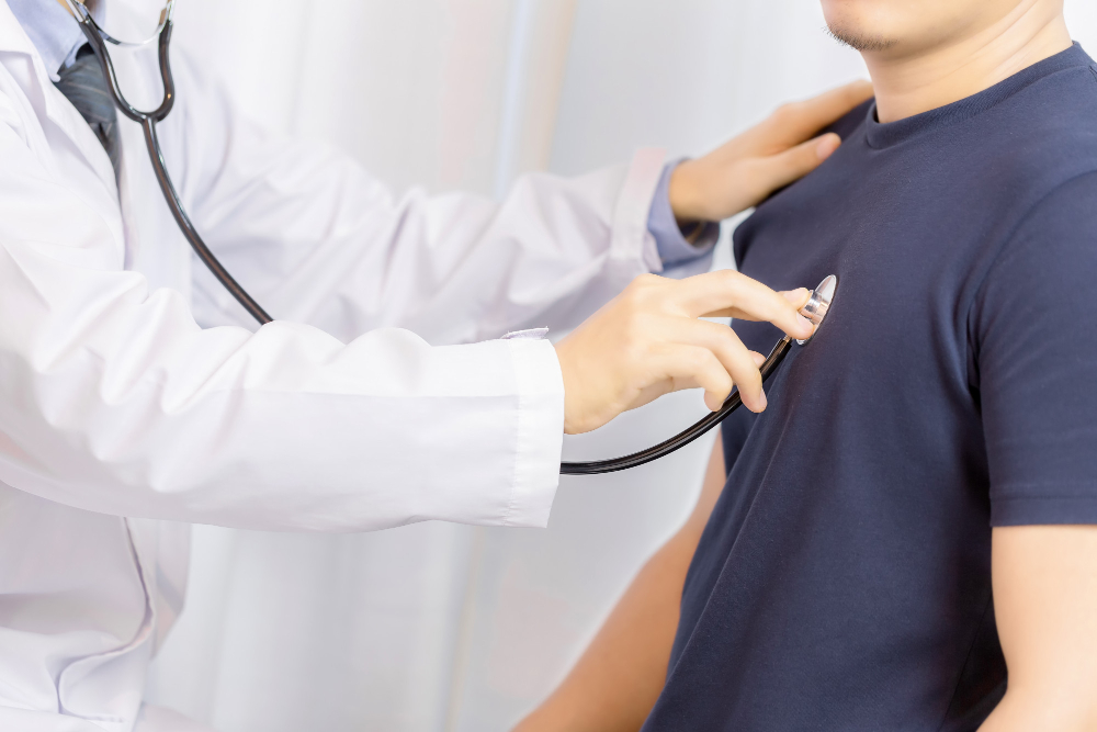 doctor checking patient with stethoscope