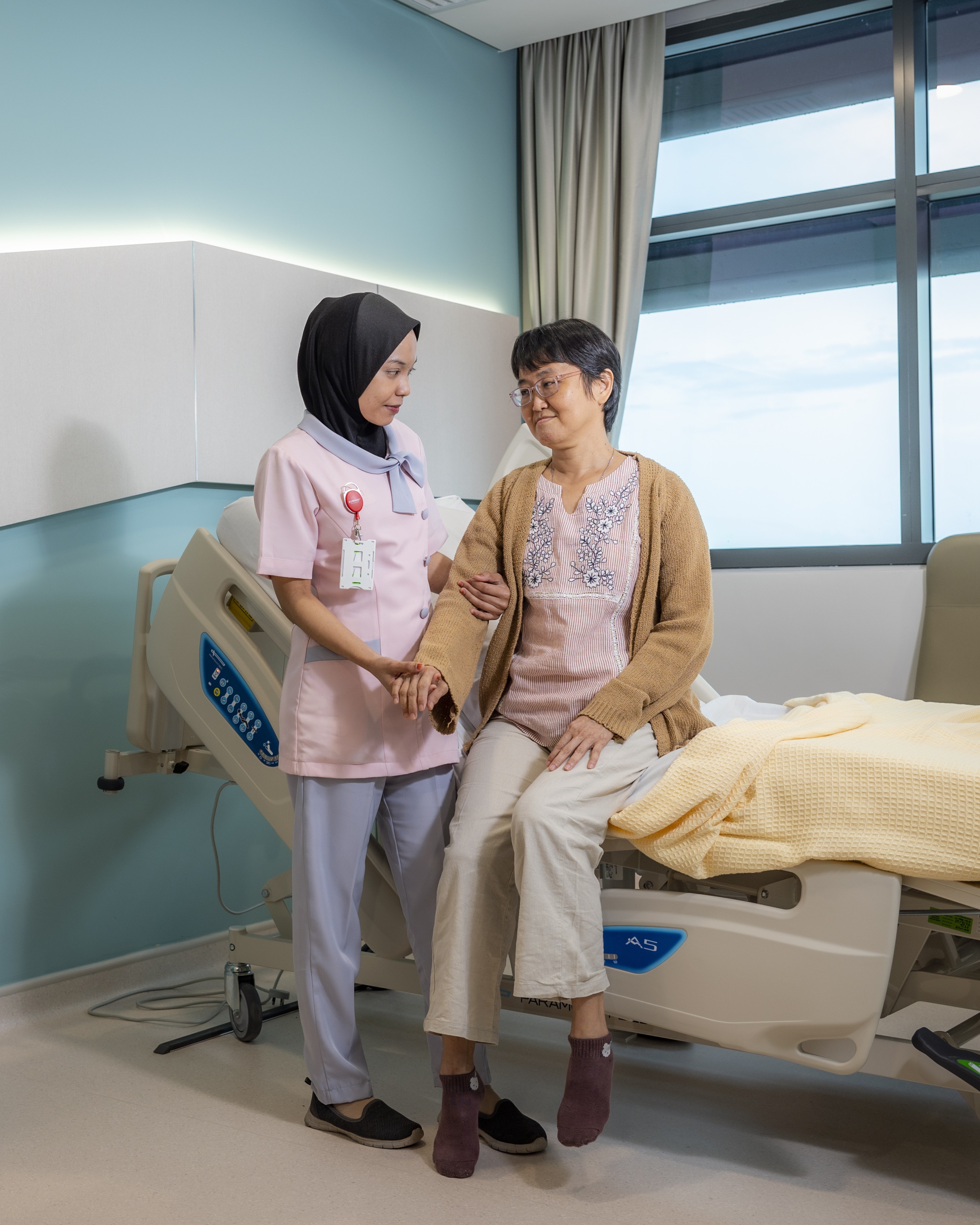 Nurse taking care of woman patient