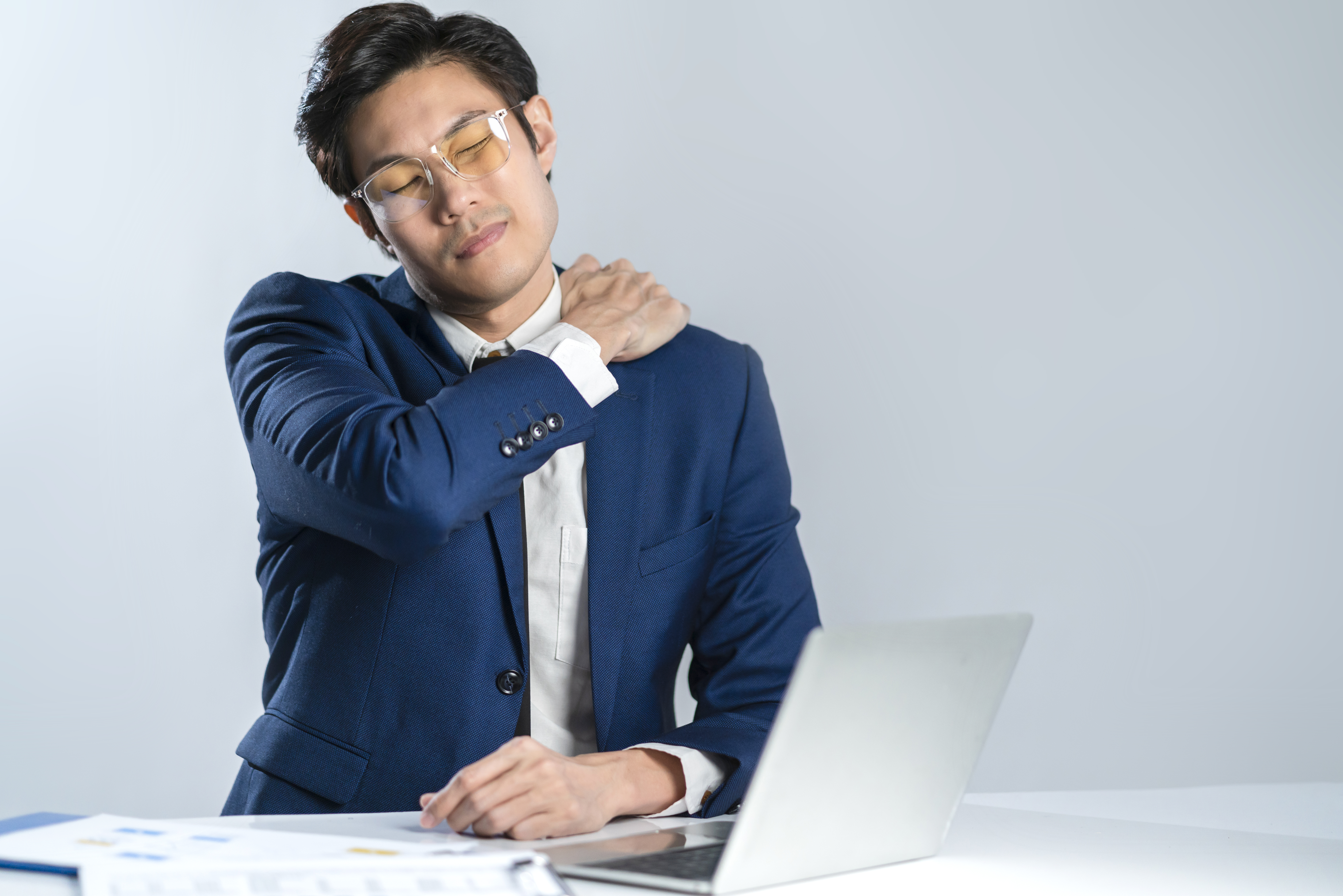 asian business man having should pain