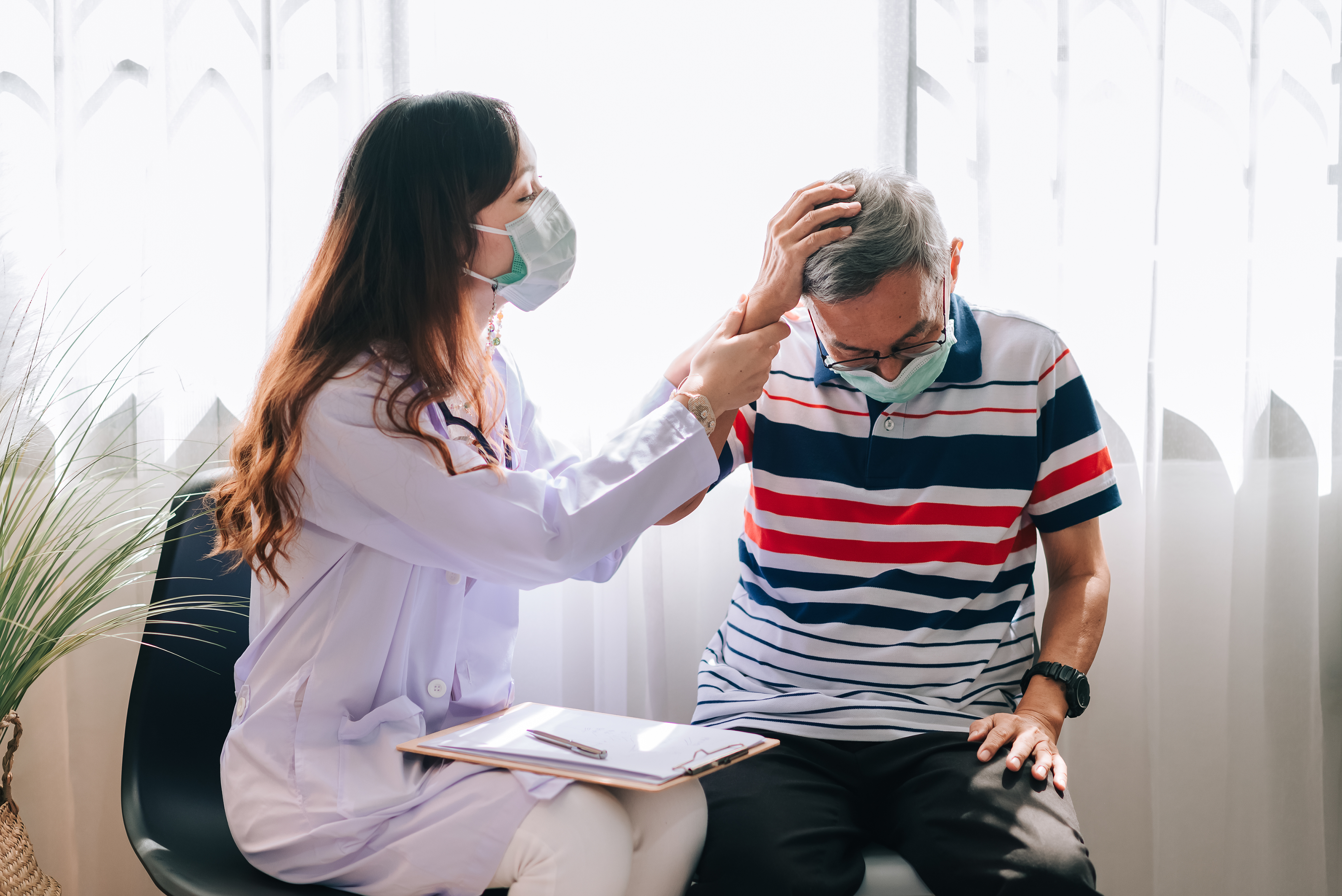 doctor checking patient that having illness on the head